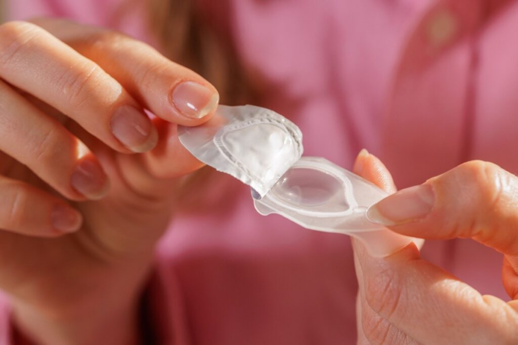 A person opening a contact lens blister pack