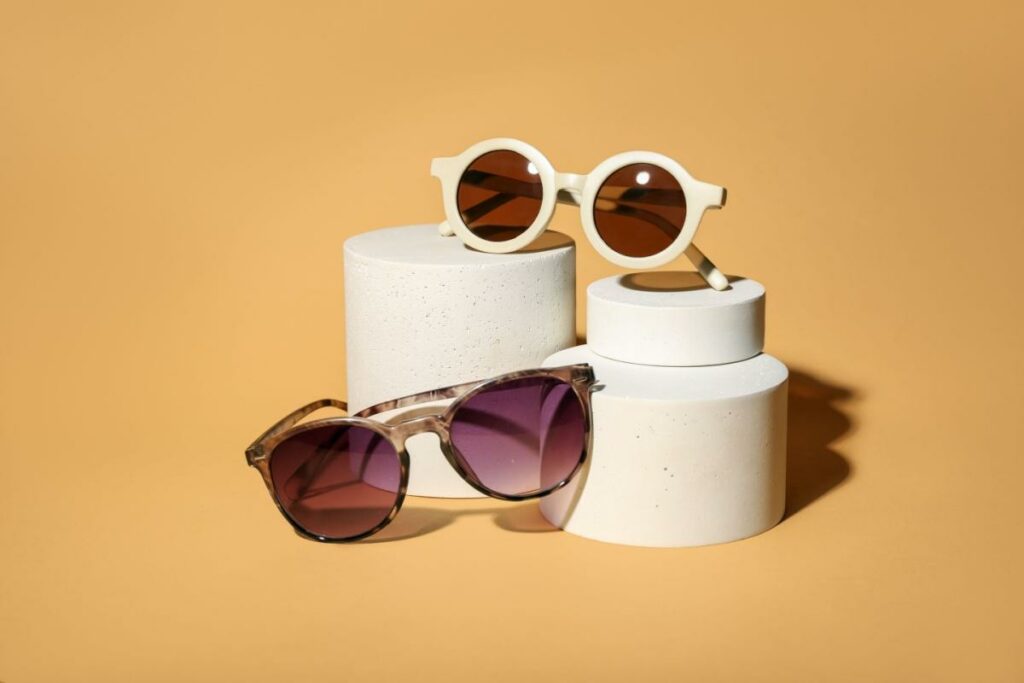 Two pairs of sunglasses set up on blocks to showcase them